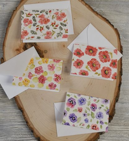set of four mini cards and envelopes with a watercolor botanical design