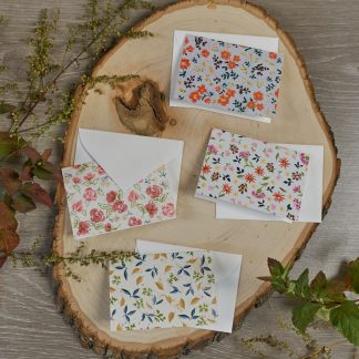 set of four mini cards and envelopes with a ditsy floral design