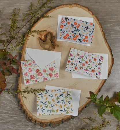set of four mini cards and envelopes with a ditsy floral design