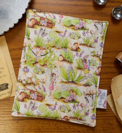 pot holder with woodland fairies on it