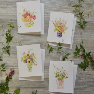 four cards with tiny watercolor bouquets on them