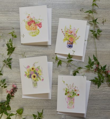 four cards with tiny watercolor bouquets on them