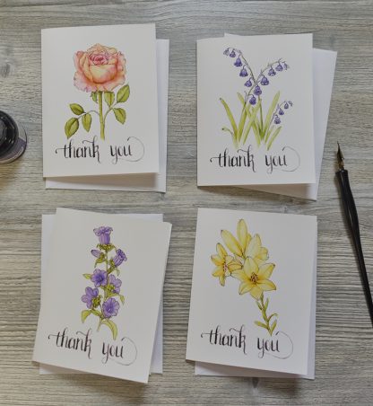 four note cards with pen and ink flowers that say thank you