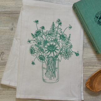 tea towel with jar of zinnia flowers